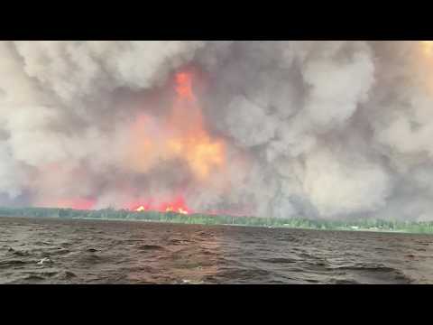Hundreds of Wildfires Burn Across Canada Sending Smoke Into the US
